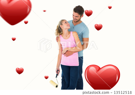Composite image of young couple painting with roller Composite image of young couple painting with roller 13512518