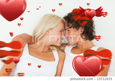 Composite image of in love couple looking at each other Composite image of in love couple looking at each other 13512635