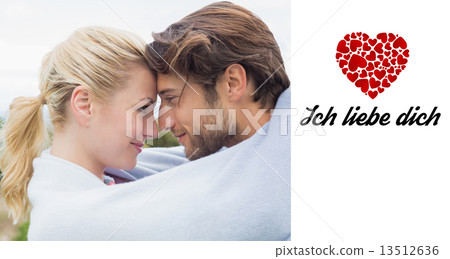 Composite image of cute affectionate couple standing outside wra Composite image of cute affectionate couple standing outside wra 13512636