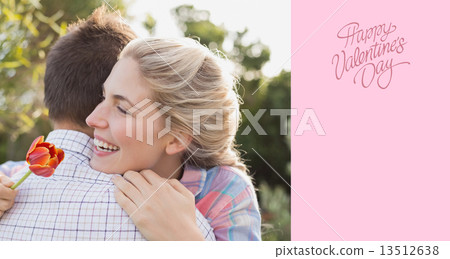 Composite image of smiling young couple embracing in park Composite image of smiling young couple embracing in park 13512638