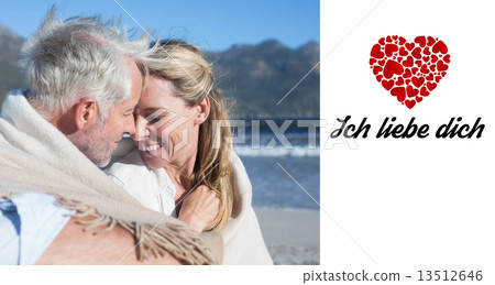Composite image of smiling couple sitting on the beach under bla Composite image of smiling couple sitting on the beach under bla 13512646