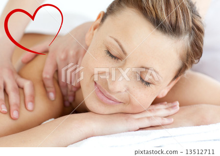 Composite image of charming woman enjoying a back massage Composite image of charming woman enjoying a back massage 13512711