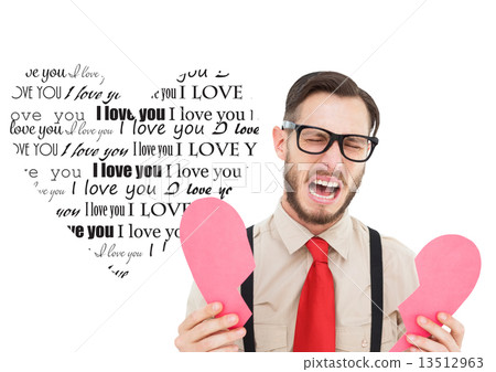 Composite image of geeky hipster crying and holding broken heart 13512963