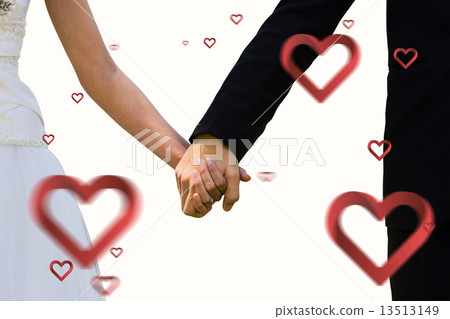 Composite image of mid section of newlywed couple holding hands 13513149