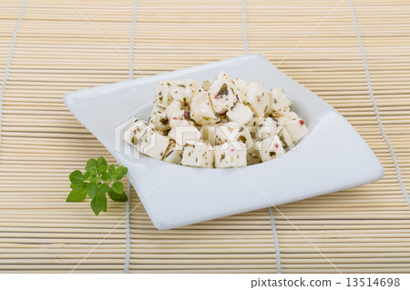 Cheese with spices and oil 13514698