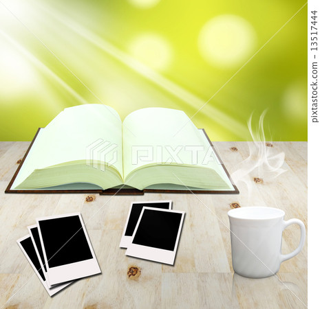 open book and instant photo with cup of coffee open book and instant photo with cup of coffee 13517444