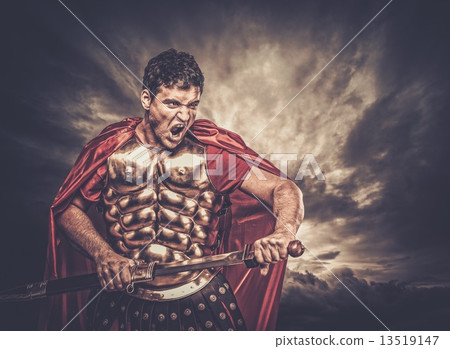 Legionary soldier against stormy sky 13519147