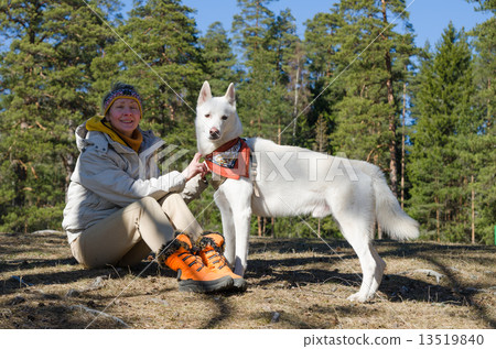 The woman with a white dog in a wood The woman with a white dog in a wood 13519840