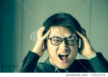 Young asian man shouting 13521172