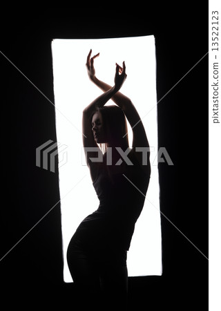 Silhouette of elegant dancer posing in frame Silhouette of elegant dancer posing in frame 13522123