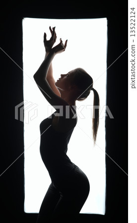 Silhouette of artistic dancer in frame Silhouette of artistic dancer in frame 13522124