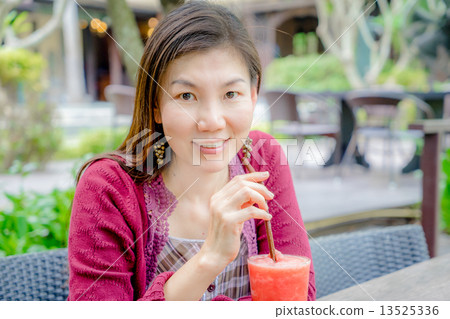 women drinking watermelon 13525336