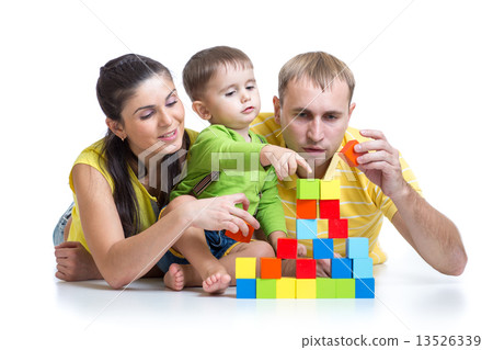 kid with his parents play building blocks kid with his parents play building blocks 13526339