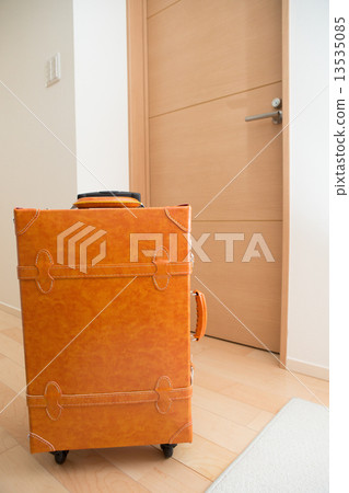 A suitcase placed in the entrance 13535085