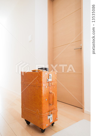 A suitcase placed in the entrance A suitcase placed in the entrance 13535086