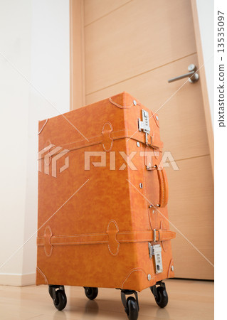 A suitcase placed in the room A suitcase placed in the room 13535097