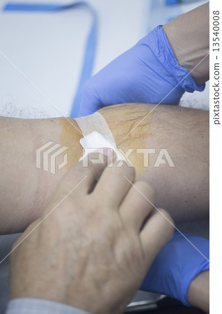 Nurse and male patient blood sample donation 13540008