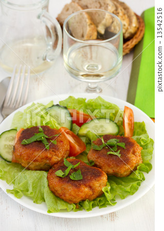 meatballs with salad on the plate and glass of wine meatballs with salad on the plate and glass of wine 13542516
