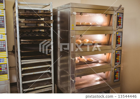 Bread rolls baking in oven 13544446