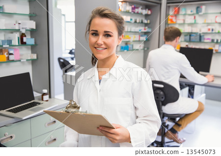 Pharmacy intern smiling at camera 13545073