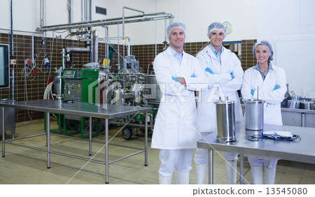 Biologist team with arms crossed smiling at camera Biologist team with arms crossed smiling at camera 13545080