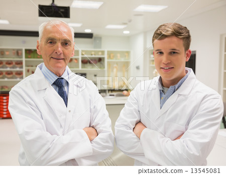 Science student and lecturer smiling at camera 13545081