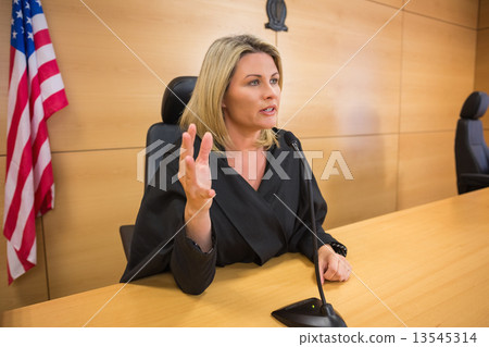 Stern judge speaking to the court 13545314