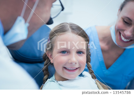 Close up portrait of girl having her teeth examined 13545786