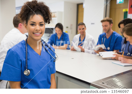 Medical student smiling at the camera during class 13546097