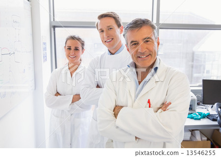 Science students and lecturer smiling at camera 13546255
