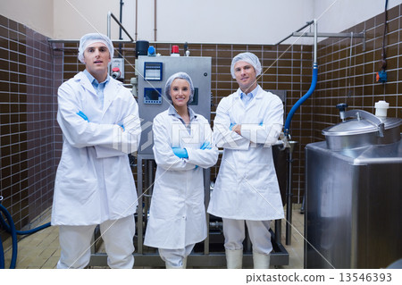 Biologist team standing smiling with arms crossed Biologist team standing smiling with arms crossed 13546393