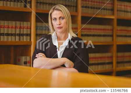 Serious lawyer looking at camera with arms crossed 13546766