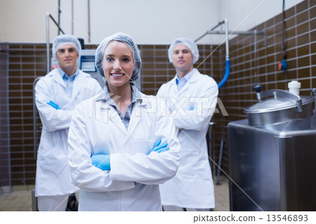 Biologist team standing smiling with arms crossed Biologist team standing smiling with arms crossed 13546893