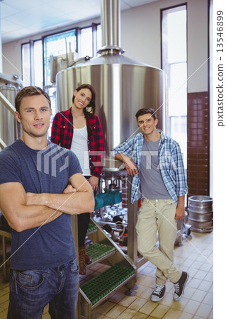 Casual happy stylish team smiling at camera together 13546899