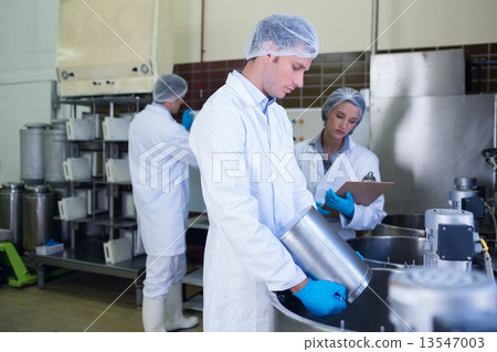 Chemist team working together while girl writing 13547003