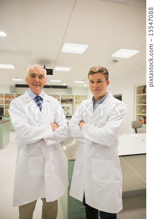 Science student and lecturer smiling at camera Science student and lecturer smiling at camera 13547088