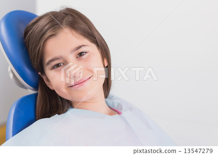 Smiling young patient sitting in dentists chair Smiling young patient sitting in dentists chair 13547279