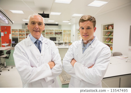 Science student and lecturer smiling at camera 13547495