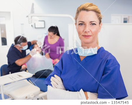 Dentist with folded arms 13547545