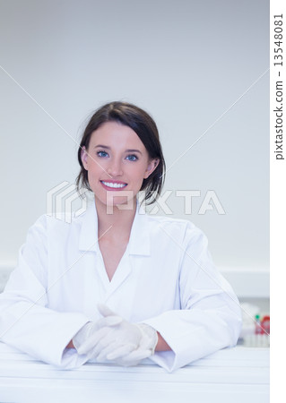 Happy biologist smiling at camera Happy biologist smiling at camera 13548081