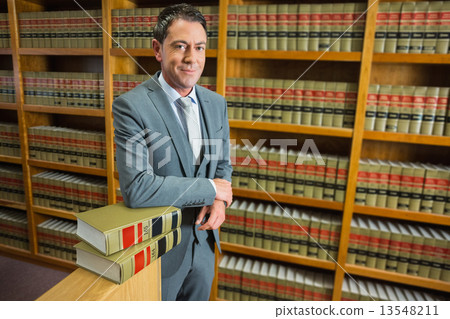 Lawyer standing in the law library Lawyer standing in the law library 13548211