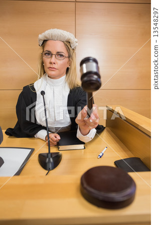 Stern judge banging her hammer 13548297