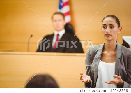 Serious lawyer make a closing statement 13548298
