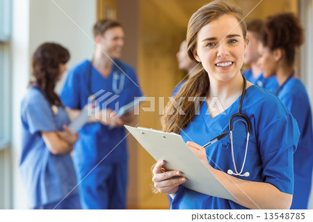 Medical student smiling at the camera Medical student smiling at the camera 13548785