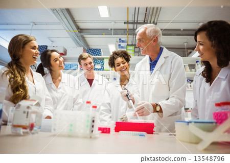 Students watching lecturer in the lab 13548796