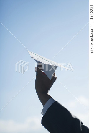 Hand of businessman with paper airplane Hand of businessman with paper airplane 13550231