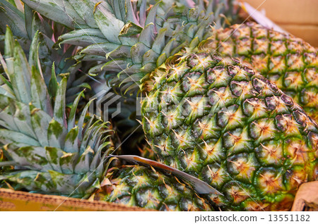 Several large pineapple on counter market Several large pineapple on counter market 13551182