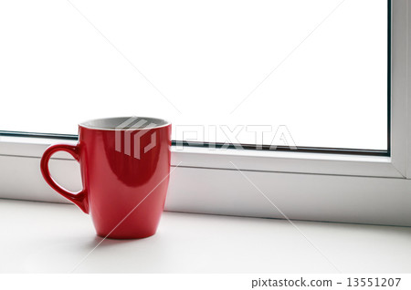 red cup on the windowsill 13551207