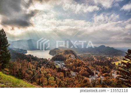 Schwangau lake in Bavaria Alps against sunset, Germany 13552118