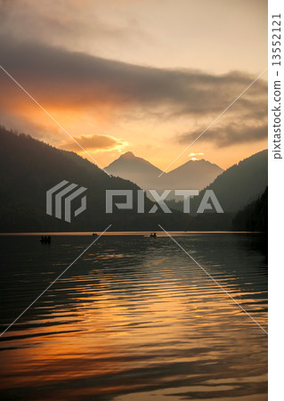 Schwangau lake in Bavaria Alps against sunset, Germany 13552121